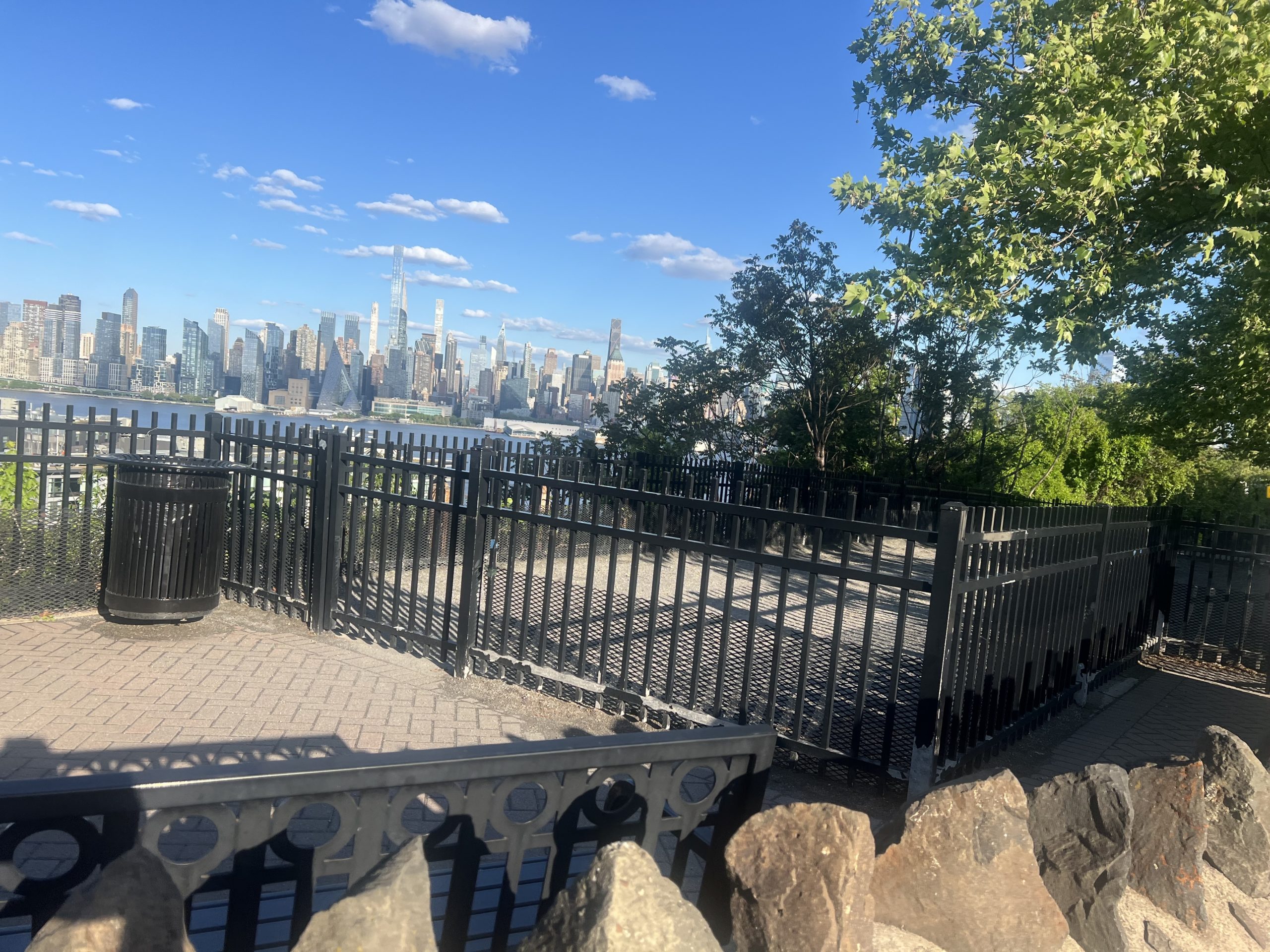 dog run with Manhattan skyline in background